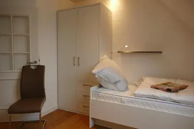 Ein Bett oder Betten in einem Zimmer der Unterkunft Ferienwohnung am Wulfkamp