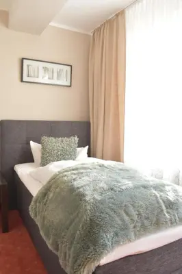 Ein Bett oder Betten in einem Zimmer der Unterkunft T&T by Thiesmann