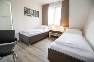 Ein Bett oder Betten in einem Zimmer der Unterkunft Hotel am Tiergarten