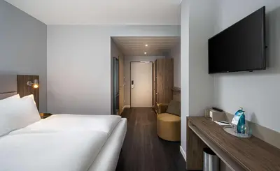 Ein Bett oder Betten in einem Zimmer der Unterkunft elaya hotel oberhausen, Trademark by Wyndham