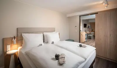 Ein Bett oder Betten in einem Zimmer der Unterkunft elaya hotel oberhausen, Trademark by Wyndham