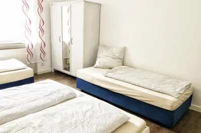 Ein Bett oder Betten in einem Zimmer der Unterkunft Wunderschöne Altbauwohnung mit Flair in Wuppertal