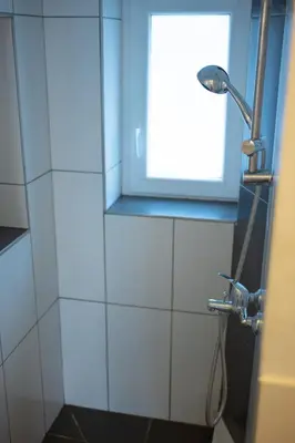 Ein Badezimmer in der Unterkunft Loft Riva, Smart TV, Klimanlage, Parkplatz fre, Minibar