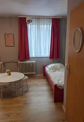Ein Bett oder Betten in einem Zimmer der Unterkunft Ruhrtropolis Hostel