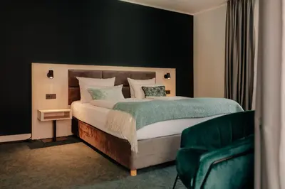 Ein Bett oder Betten in einem Zimmer der Unterkunft Stadthotel Borken by Hackmann