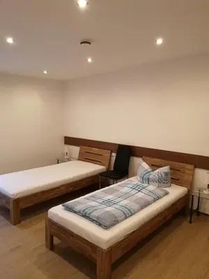 Ein Bett oder Betten in einem Zimmer der Unterkunft Ferienhof Schnieder