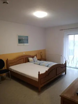Ein Bett oder Betten in einem Zimmer der Unterkunft Ferienhof Schnieder