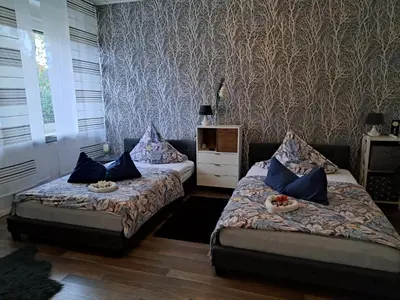 Ein Bett oder Betten in einem Zimmer der Unterkunft Ferienwohnung Talblume