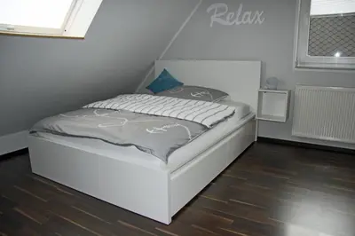 Ein Bett oder Betten in einem Zimmer der Unterkunft Ferienwohnung Brandheide