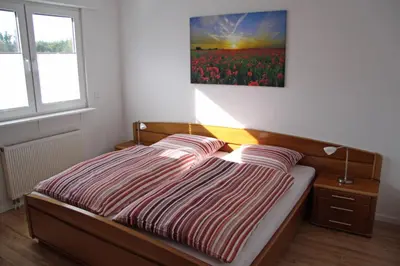 Ein Bett oder Betten in einem Zimmer der Unterkunft Ferienwohnung Brandheide