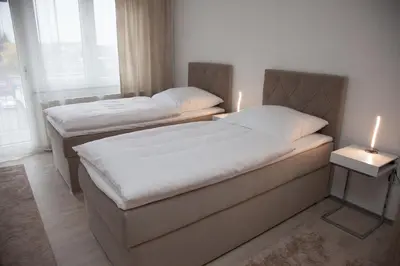 Ein Bett oder Betten in einem Zimmer der Unterkunft T&K Apartments near Messe Fair Trade Düsseldorf und Airport 2B