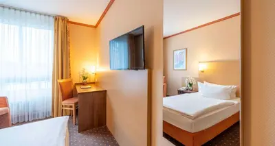 Ein Bett oder Betten in einem Zimmer der Unterkunft Sure Hotel by Best Western Hilden-Düsseldorf