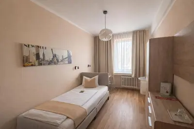 Ein Bett oder Betten in einem Zimmer der Unterkunft Arena Hotel