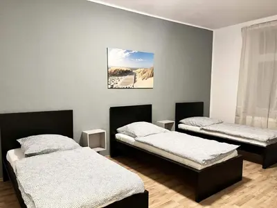 Ein Bett oder Betten in einem Zimmer der Unterkunft cosy three room apartment with flatscreen TV