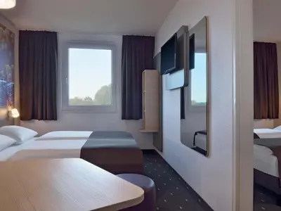 Ein Bett oder Betten in einem Zimmer der Unterkunft B&B Hotel Düsseldorf-Ratingen