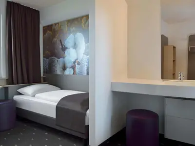 Ein Bett oder Betten in einem Zimmer der Unterkunft B&B Hotel Düsseldorf-Ratingen