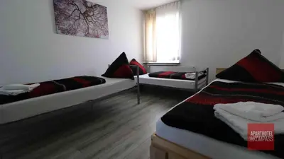 Ein Bett oder Betten in einem Zimmer der Unterkunft Aparthotel Kompass A 201
