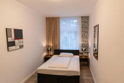 Ein Bett oder Betten in einem Zimmer der Unterkunft Hotel Berliner Hof