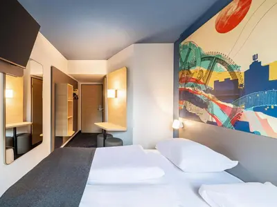 Ein Bett oder Betten in einem Zimmer der Unterkunft B&B HOTEL Dortmund-West