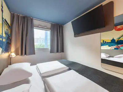 Ein Bett oder Betten in einem Zimmer der Unterkunft B&B HOTEL Dortmund-West