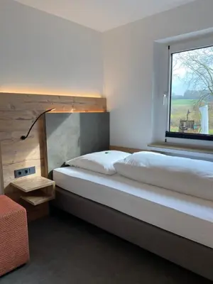 Ein Bett oder Betten in einem Zimmer der Unterkunft Hotel Mintarder Wasserbahnhof