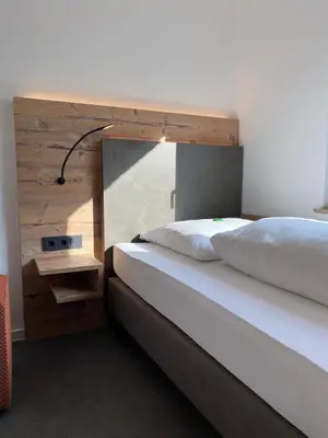 Ein Bett oder Betten in einem Zimmer der Unterkunft Hotel Mintarder Wasserbahnhof