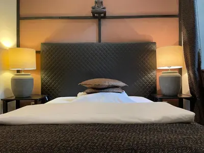 Ein Bett oder Betten in einem Zimmer der Unterkunft Hotel Am Volksgarten