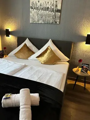 Ein Bett oder Betten in einem Zimmer der Unterkunft Hotel Restaurant zum Löwen