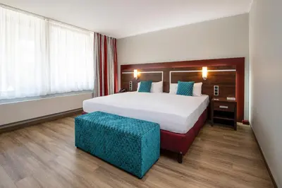 Ein Bett oder Betten in einem Zimmer der Unterkunft Ringhotel Zweibruecker Hof
