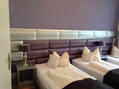 Ein Bett oder Betten in einem Zimmer der Unterkunft Hotel Am Wehrhahn
