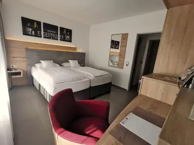 Ein Bett oder Betten in einem Zimmer der Unterkunft Akzent Hotel Körner Hof