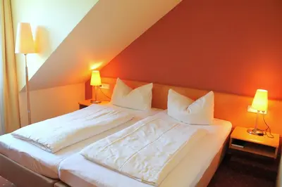 Ein Bett oder Betten in einem Zimmer der Unterkunft Hotel und Restaurant Eurohof