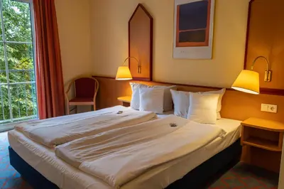 Ein Bett oder Betten in einem Zimmer der Unterkunft Montana Hotel Senden