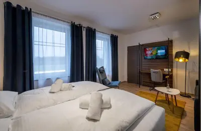 Ein Bett oder Betten in einem Zimmer der Unterkunft Hotel Zu Freunden