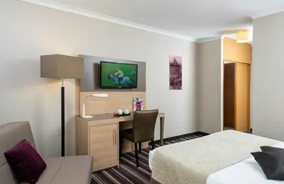 Ein Bett oder Betten in einem Zimmer der Unterkunft Leonardo Hotel Düsseldorf Airport Ratingen