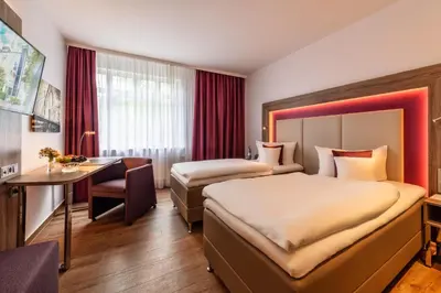 Ein Bett oder Betten in einem Zimmer der Unterkunft Best Western Plus Hotel Stadtquartier Haan
