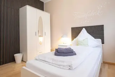 Ein Bett oder Betten in einem Zimmer der Unterkunft Apartment mit Wohnflair