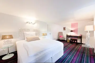 Ein Bett oder Betten in einem Zimmer der Unterkunft Pension Café Eisgold