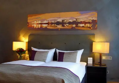 Ein Bett oder Betten in einem Zimmer der Unterkunft Wyndham Duisburger Hof