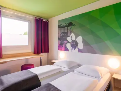 Ein Bett oder Betten in einem Zimmer der Unterkunft B&B Hotel Bochum-Herne