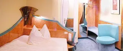 Ein Bett oder Betten in einem Zimmer der Unterkunft City Hotel Essen