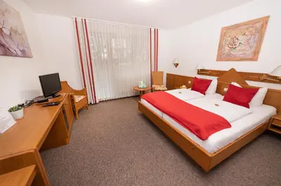 Ein Bett oder Betten in einem Zimmer der Unterkunft Hotel am Schlosspark Essen