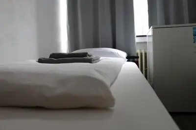 Ein Bett oder Betten in einem Zimmer der Unterkunft Hotel Berliner Hof