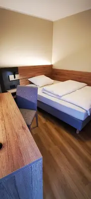 Ein Bett oder Betten in einem Zimmer der Unterkunft Atelier Hotel Essen-City