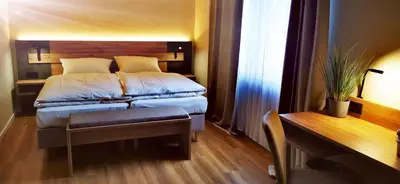 Ein Bett oder Betten in einem Zimmer der Unterkunft Atelier Hotel Essen-City