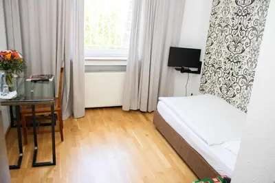 Ein Bett oder Betten in einem Zimmer der Unterkunft Hotel Stern - Self Check-In