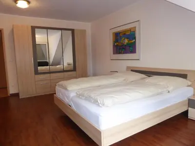 Ein Bett oder Betten in einem Zimmer der Unterkunft Hotel Am Sportpark