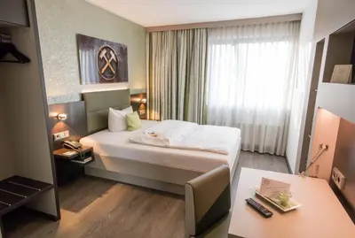 Ein Bett oder Betten in einem Zimmer der Unterkunft Ringhotel Drees