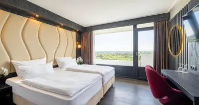 Ein Bett oder Betten in einem Zimmer der Unterkunft PLAZA Hotel Gelsenkirchen