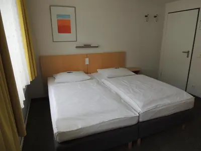 Ein Bett oder Betten in einem Zimmer der Unterkunft CVJM Düsseldorf Hotel & Tagung